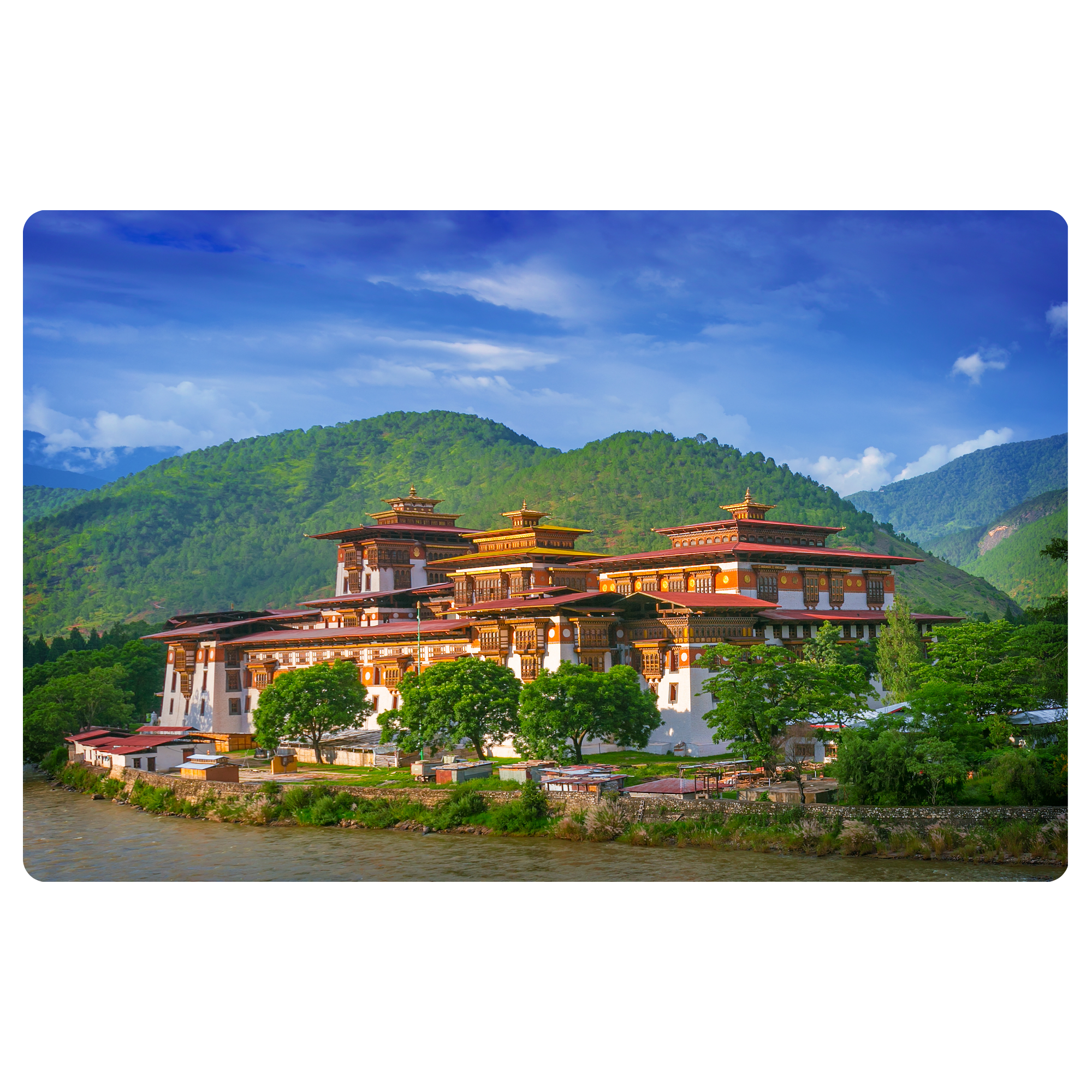 Image of palace in Bhutan set against a river and mountain backdrop