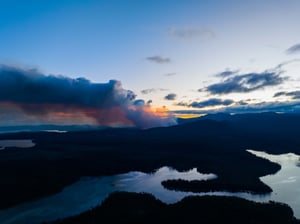 smoke rising over a hill in tasmania australia